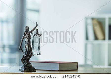 close up view of femida and book on tabletop in office