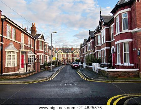 Crossing Road And Old Red Brick Buildings