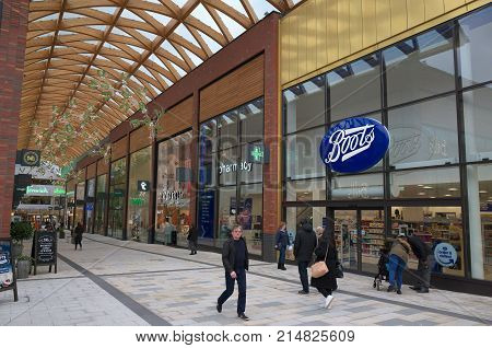 Bracknell, England - Nov 22, 2017: People passing by the Boots store in the Lexicon shopping center, opened in 2017 as part of the ongoing redevelopment of Bracknell Town in England