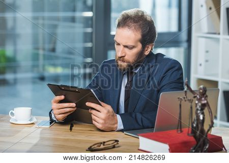 Lawyer With Contract At Workplace
