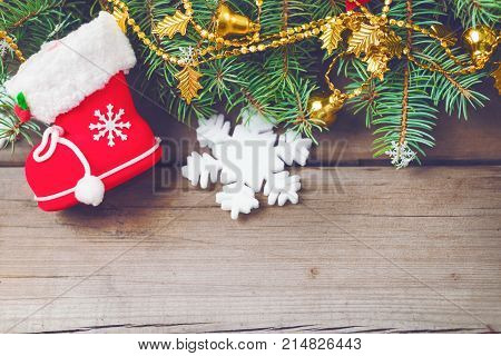 Christmas decorations on old dark boards. Christmas background. Christmas Socks. New Year background. Xmax background. Christmas tree. Toned image.