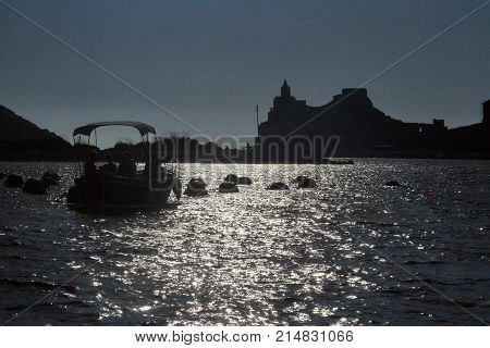 Fishing boats in the afternoon in front of Portovenere