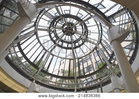 DUSSELDORF, GERMANY, JUN.13, 2010: Modern round metal and glass dome cupola. Abstract architecture element. Architectural elements parts details metal glass dome. Inside interior view on glass dome