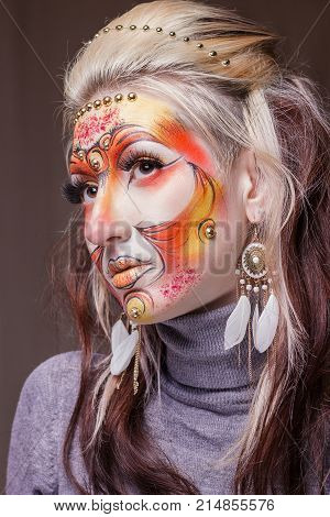 Woman portrait with bodyart in halloween style