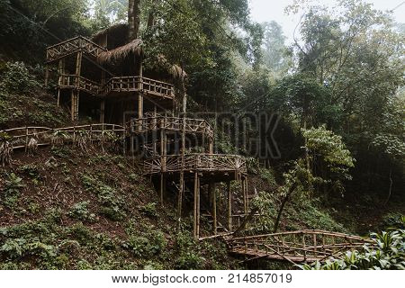 Wooden Bamboo Hovel House In Forest. Film Color Toned Filter