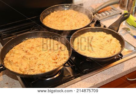Pans With The Food Named Frico A Typical Italian Dish With Potat