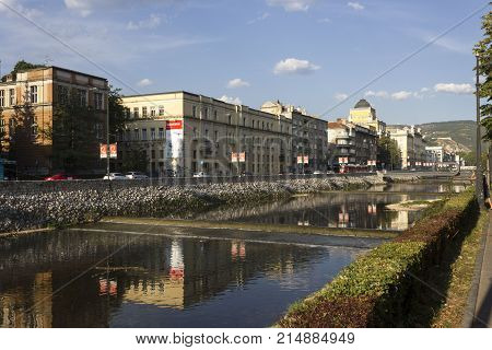 SARAJEVO, BOSNIA AND HERZEGOVINA - AUGUST 18 2017: Outdoor view of Sarajevo on the river front of Miljacka river in summer season