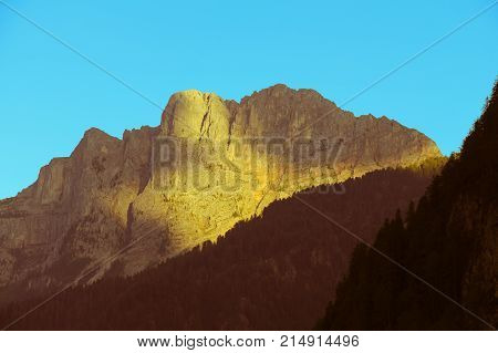 The view of mountain massif at sunset light.