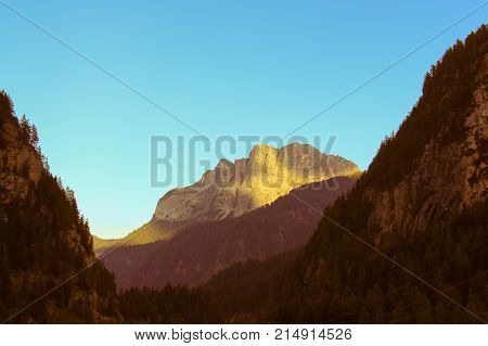 The view of mountain massif at sunset light.