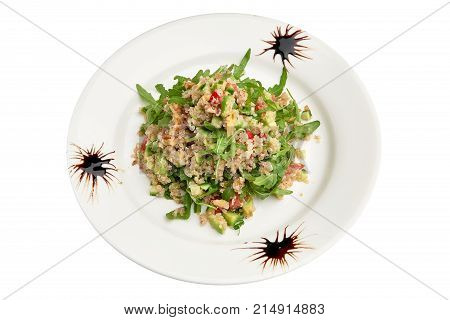 Kinoa on a plate on a white background isolation