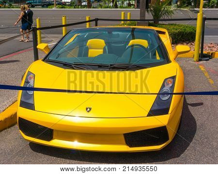 Las Vegas, United States of America - May 05, 2016: Luxurious and Colorful Cars for Rent Waiting in the Parking Lot of a Supermarket on the Las Vagas Strip, Nevada on May 05, 2016