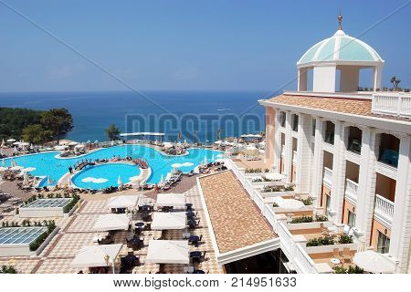 Alanya, Turkey - June 4, 2015: Panoramic view of the territory with a swimming pool and an original building in the high class hotel Litore Resort, Turkey.
