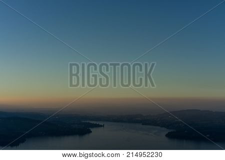 view of lake lucerne from buergenstock with fog tourism spot