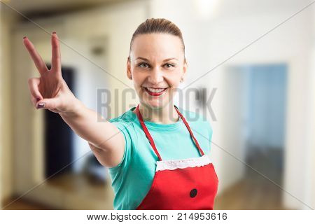Happy Smiling Housewife Showing Peace Vistory Gesture