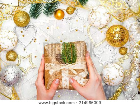 Christmas Present with Gold Ribbon and Gold Christmas Decorations