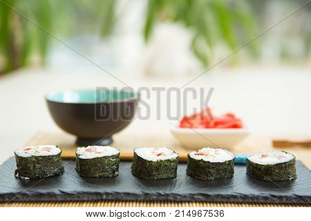 Maki Roll With Salmon, Popular Japanese Cuisine. Sushi Roll With Fish, Cream Cheese And Vegetables