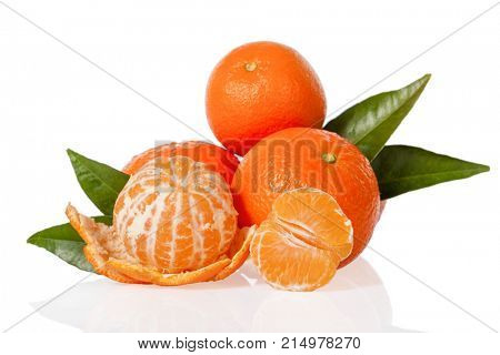Orange Mandarines, Clementines, Tangerines or small oranges with one peeled and cut in half with leaves isolated on white background, cut out or cutout