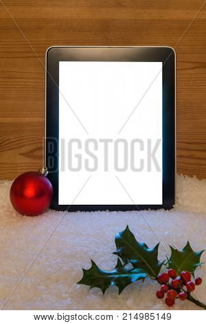 A Christmas still life with blank tablet screen and clipping path to add your own message.
