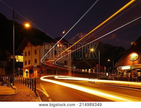 CANAZEI, ITALY - OCTOBER 27 - 2016 - Nightscape in Canazei Resort with Peak Vernel, the base station for many excursions and rock climbs to the Sella Marmolada and Sassolungo Group, Dolomites, Italy