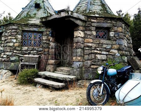 Osaka, Japan - FEB 12, 2017 : Hagrid's motorbike and background home Hagrid at Universal Studios Japan.The Harry Potter is famous themed attractions in the Universal Studios Japan Theme Park.