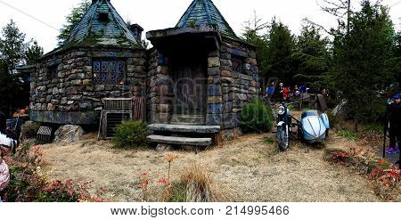 Osaka, Japan - FEB 12, 2017 : Hagrid's motorbike and background home Hagrid at Universal Studios Japan.The Harry Potter is famous themed attractions in the Universal Studios Japan Theme Park.