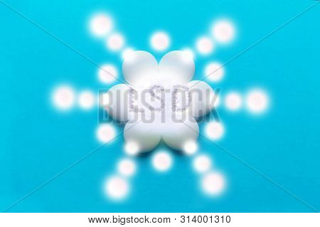 Lsd Light Sign Inscription Light Patterns On Blue Background