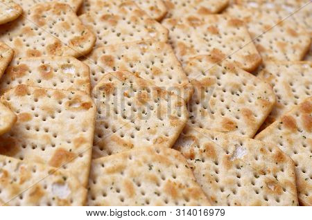 Tuc Original Snack Crackers Lies On Market Table Stacked In Big Pile