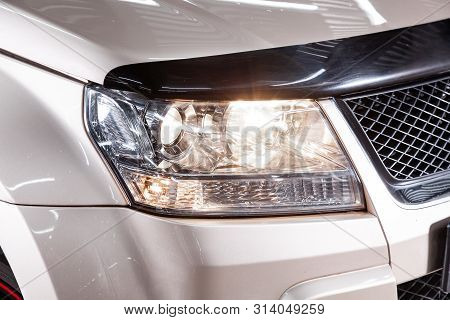 Novosibirsk, Russia - July 08, 2019: Suzuki Grand Vitara, Close-up Of The Headlight, Bumper, Wheel. 