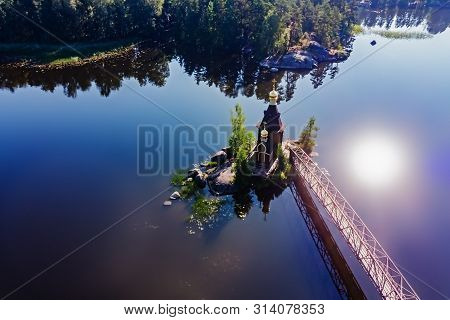 Panorama Of The Vuoksa River Overlooking The Church Of St. Andrew The First Called On A Sunny Summer