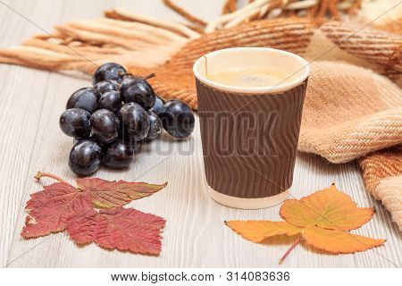 Cup Of Coffee, Grapes And Dry Leaves In An Autumn Still Llife.
