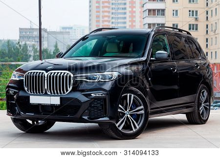Novosibirsk, Russia - 07.20.2019: Black New Bmw X7 Xdrive40i 2019 Year Front View With Light Gray In