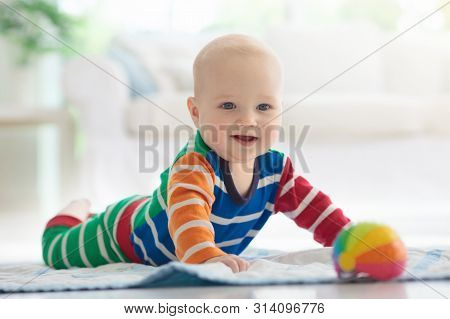 Baby Boy With Toys And Ball
