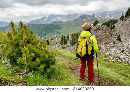 An Hiker Woman With View Of Tena Valley In The Pyrenees, Formigal,  Huesca, Spain