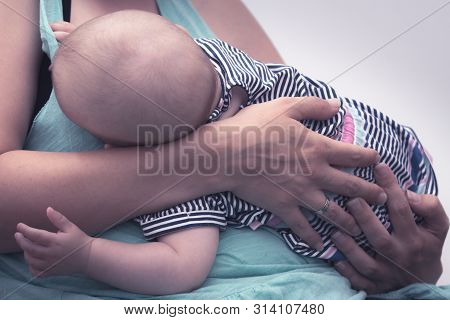 Baby Breastfeeding.  Mother Breastfeed Baby. New Born Baby Breastfeeding. Mother And Baby. Mother Br