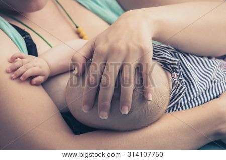 Baby Breastfeeding.  Mother Breastfeed Baby. New Born Baby Breastfeeding. Mother And Baby. Mother Br