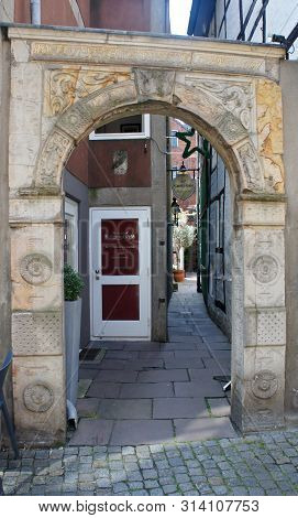 Bremen, Germany - 07 23 2015 - Scenic View Of Medieval Street Schnoor Through The Arch, Half-timbere