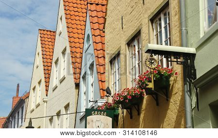 Bremen, Germany - 07 23 2015 - Picturesque View Of Half-timbered Houses Roofs In Medieval Street Sch