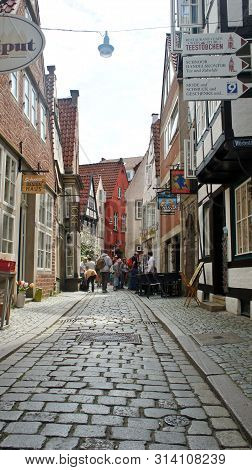 Bremen, Germany - 07 23 2015 - Picturesque View Of Medieval Street Schnoor, Half-timbered Houses In 