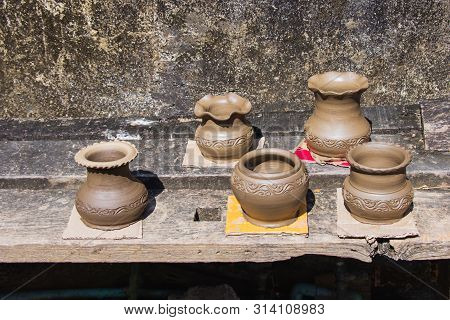 Clay Pots Made By Hand Of Thai Traditional Pottery Jar Placed In The Outdoor To The Sun Of Villages 