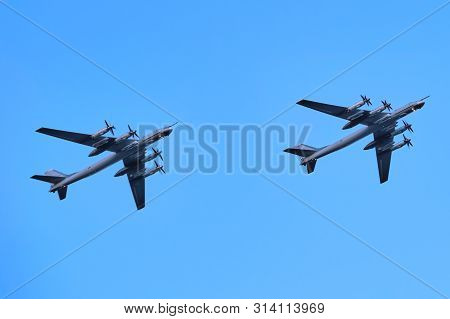 Two Airplanes Upshot Against Clear Blue Sky