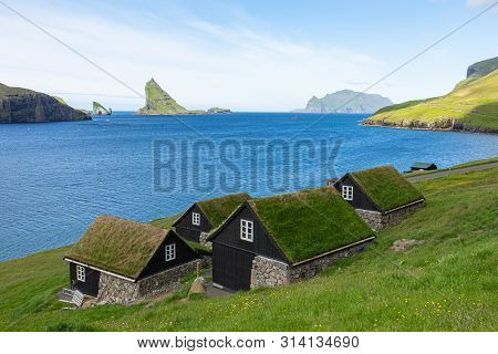 Bour Village. Typical Grass-roof Houses And Green Mountains. Vagar Island, Faroe Islands. Denmark. E