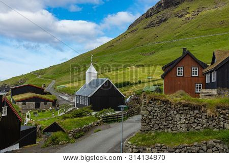 Bour Village. Typical Grass-roof Houses And Green Mountains. Vagar Island, Faroe Islands. Denmark. E