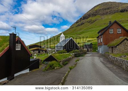 Bour Village. Typical Grass-roof Houses And Green Mountains. Vagar Island, Faroe Islands. Denmark. E