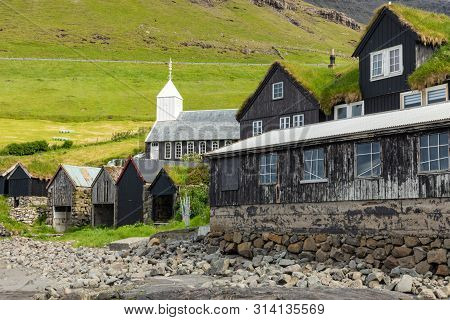 Bour Village. Typical Grass-roof Houses And Green Mountains. Vagar Island, Faroe Islands. Denmark. E
