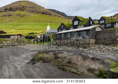 Bour Village. Typical Grass-roof Houses And Green Mountains. Vagar Island, Faroe Islands. Denmark. E