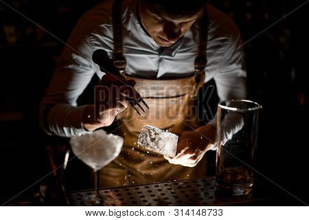 Bartender Crushes An Ice Cube With Crusher