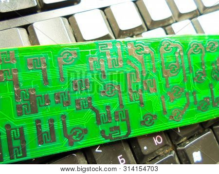 Green Electronic Board On The Keyboard. Repair Of Equipment. System Administrator.