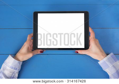 Mockup Image: Close Up Top View Of Woman Looking At Modern Digital Tablet Computer Device With White
