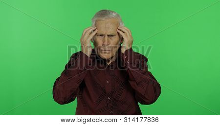 Senior Man Suffer By Headache Pain Trouble Holding Head With Hands. Handsome Old Man On Chroma Key B