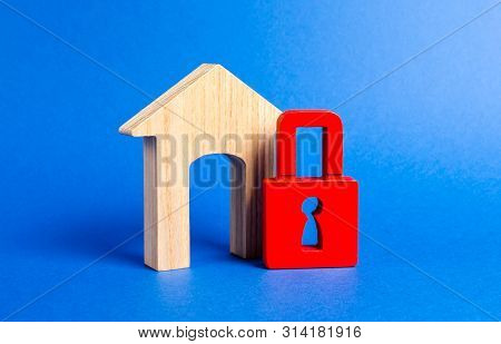 House Figurine With Large Doorway And Red Padlock. Security And Safety. Confiscation For Debts. Alar